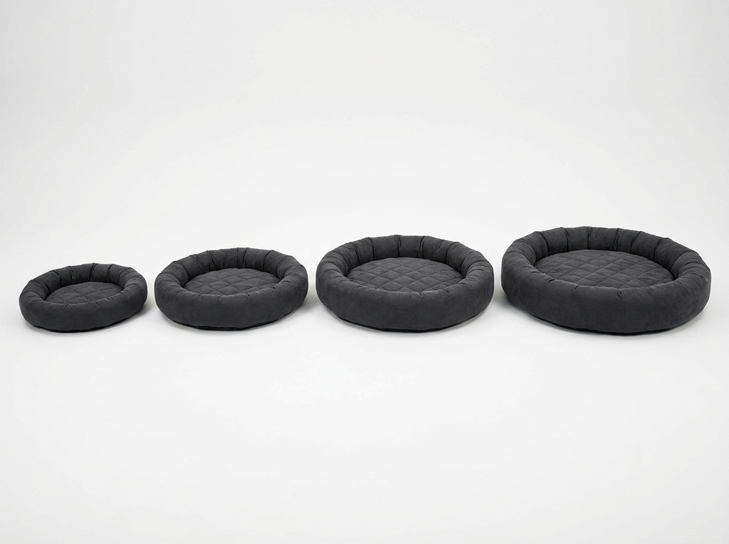 Cloud Rest orthopedic memory foam pet bed in dark grey shown in four sizes side by side, Medium to XXL, illustrating the size range